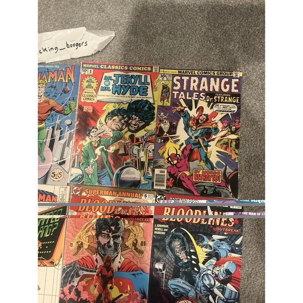Vintage 15 lot of superhero comic books from both DC and Marvel publishers.
